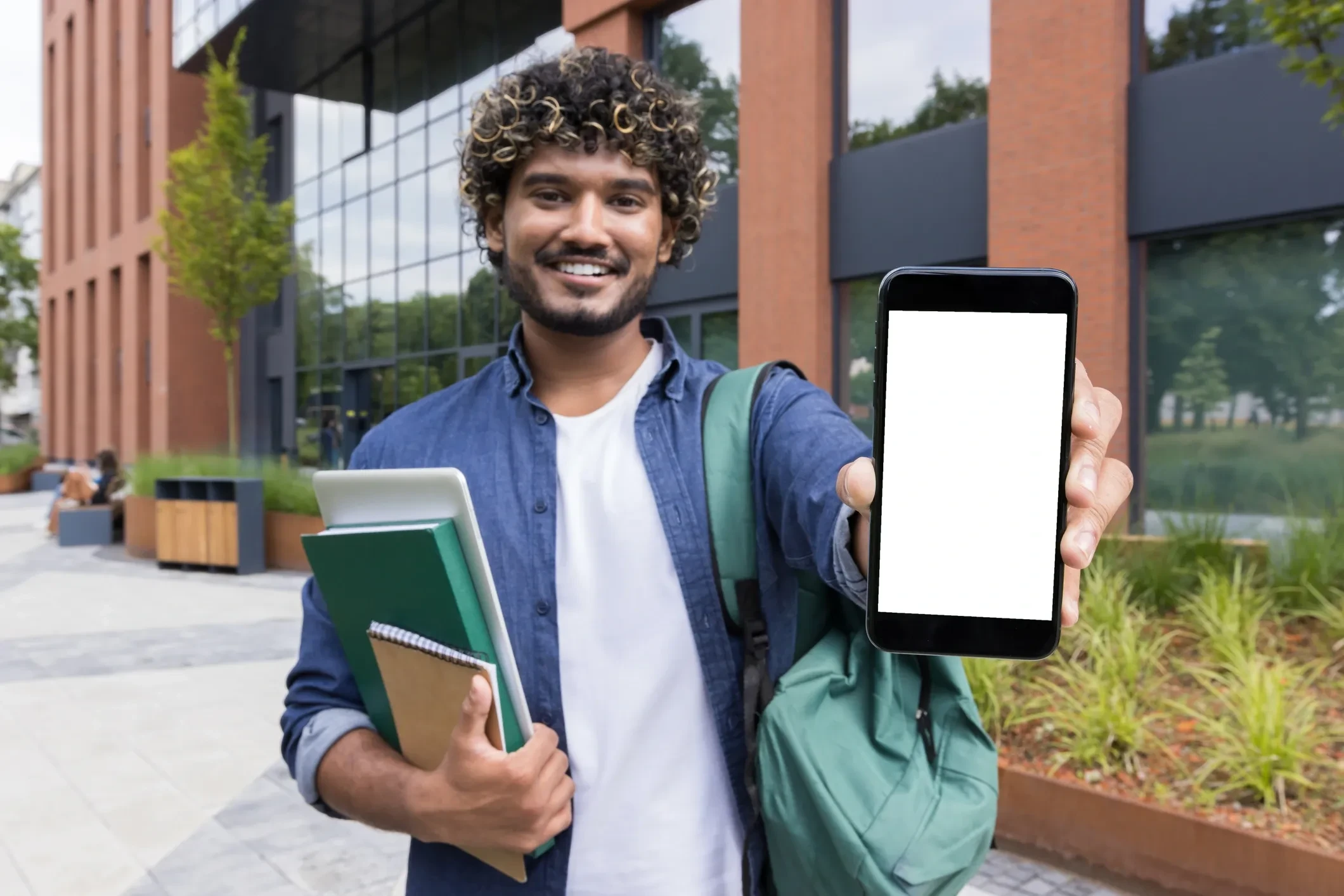 Spark student holding phone